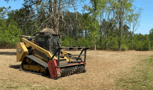 Forestry mulching in progress on a Hendersonville NC property